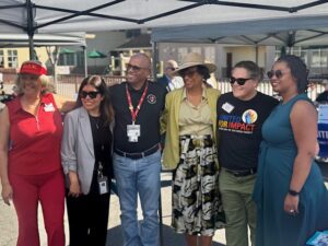 Diverse group posing outdoors at an event